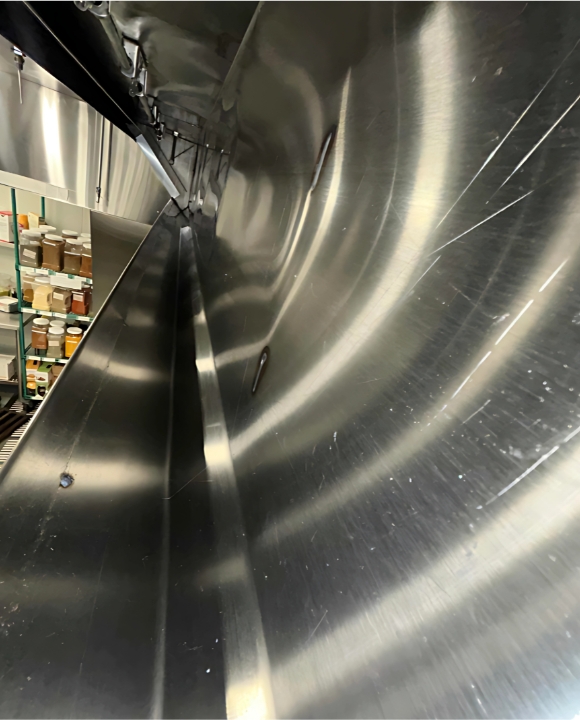 Clean upper hood of comercial kitchen